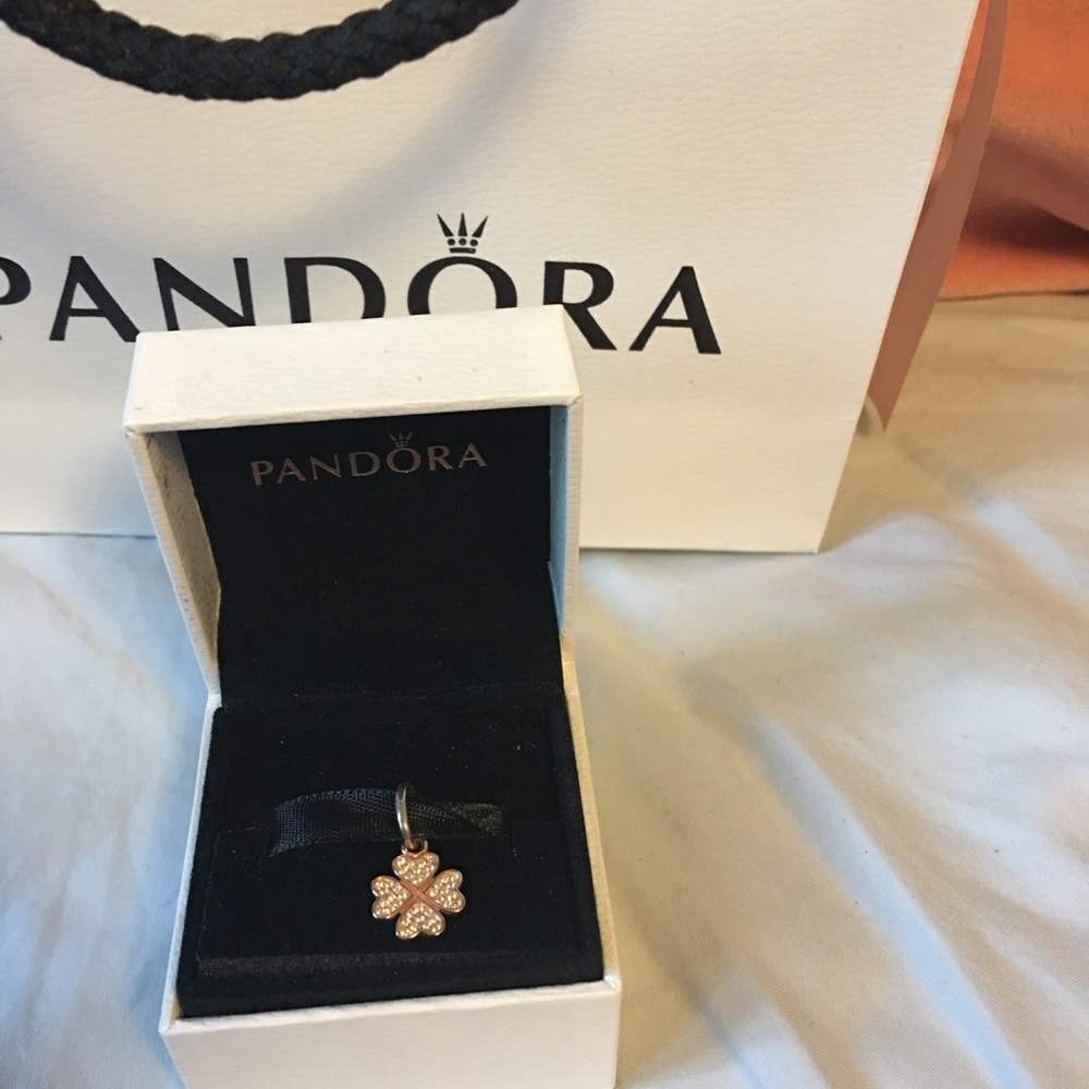 Pandora “symbol of lucky in love” charm in 14K gold and sterling silver